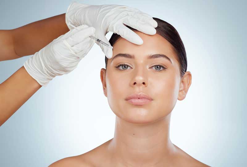 Woman getting a Botox injection.