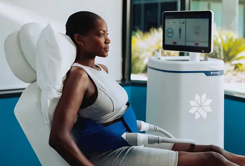 a woman getting a coolsculpting treatment to reduce fat.