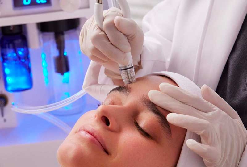 woman getting a diamond glow treatment