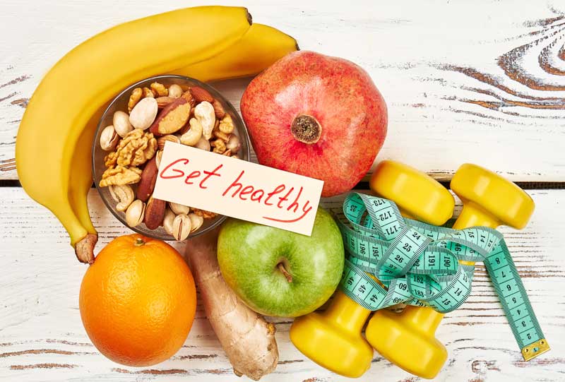 get healthy sign with fruit and vegetables around it